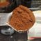 Kini Embu coffee grounds in a tablespoon