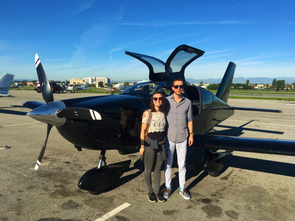 alex and ethan in front of the black socata tobago tb-10 at zamperini field in torrance - happy!