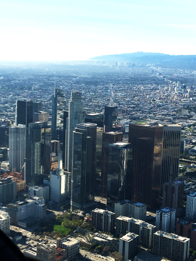 best shot of shining skyscrapers dtla, century city, all the way to mountains and ocean