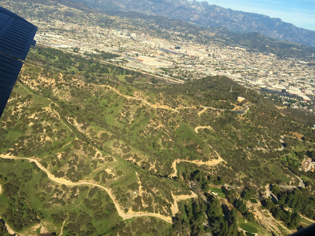 flying over mountain trails and roads