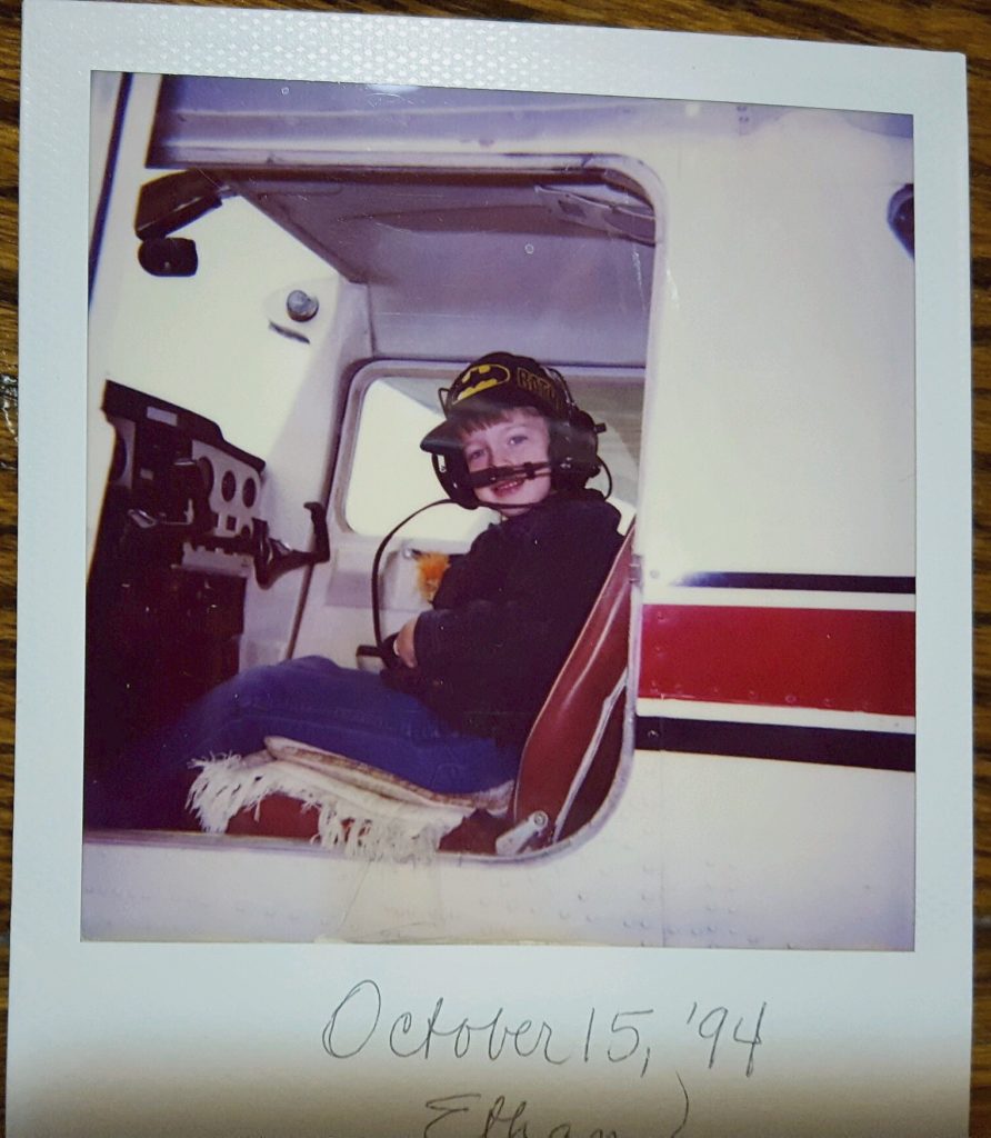 polaroid of mini-batman-ethan in a plane: october 15 1994