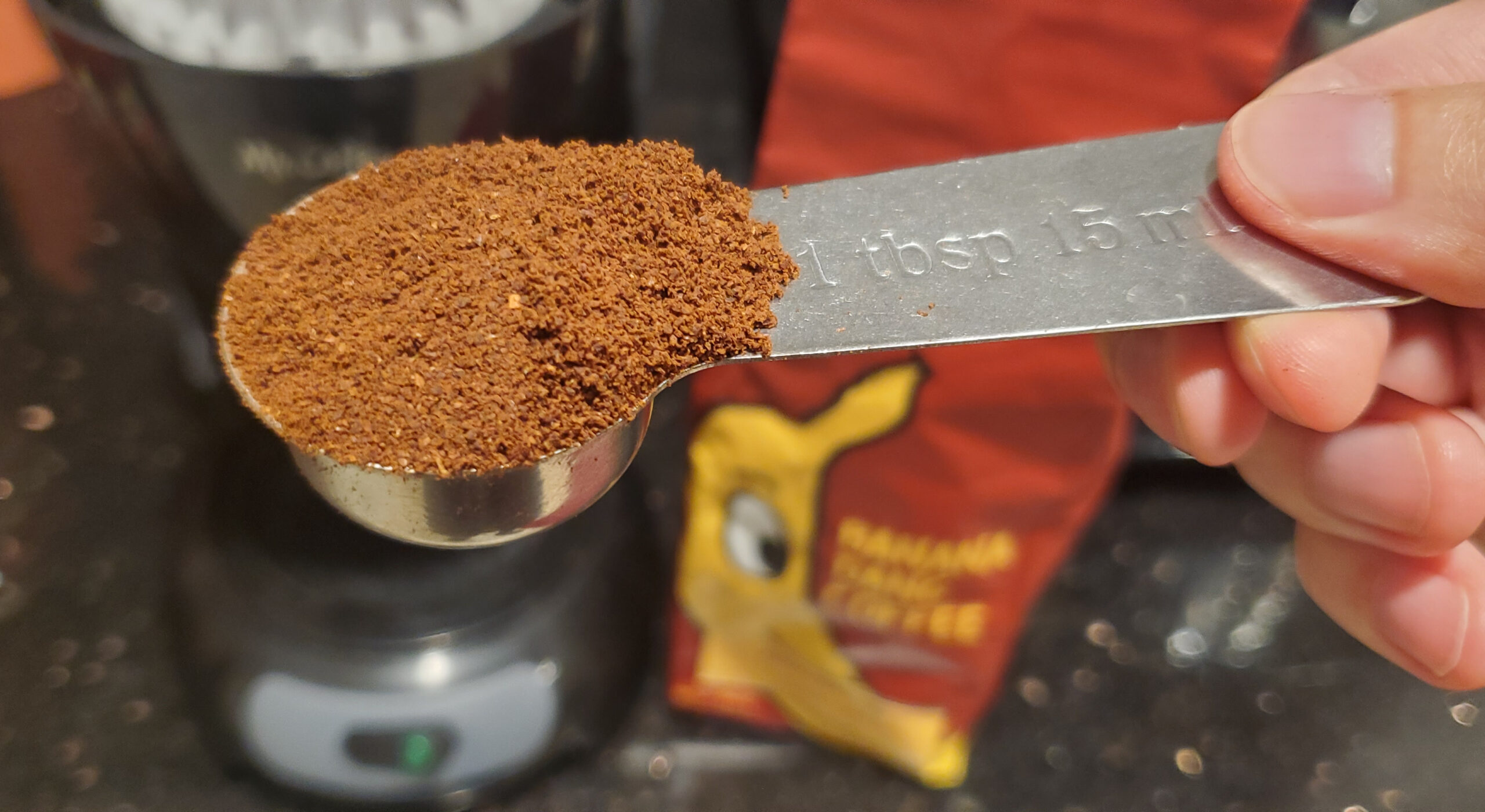 Banana Dang coffee grounds in a tablespoon.