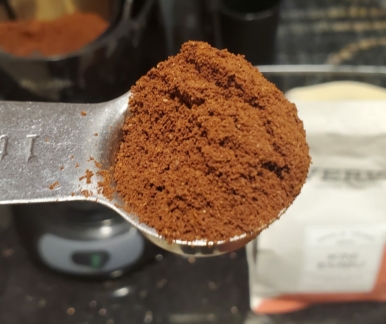 Kini Embu coffee grounds in a tablespoon