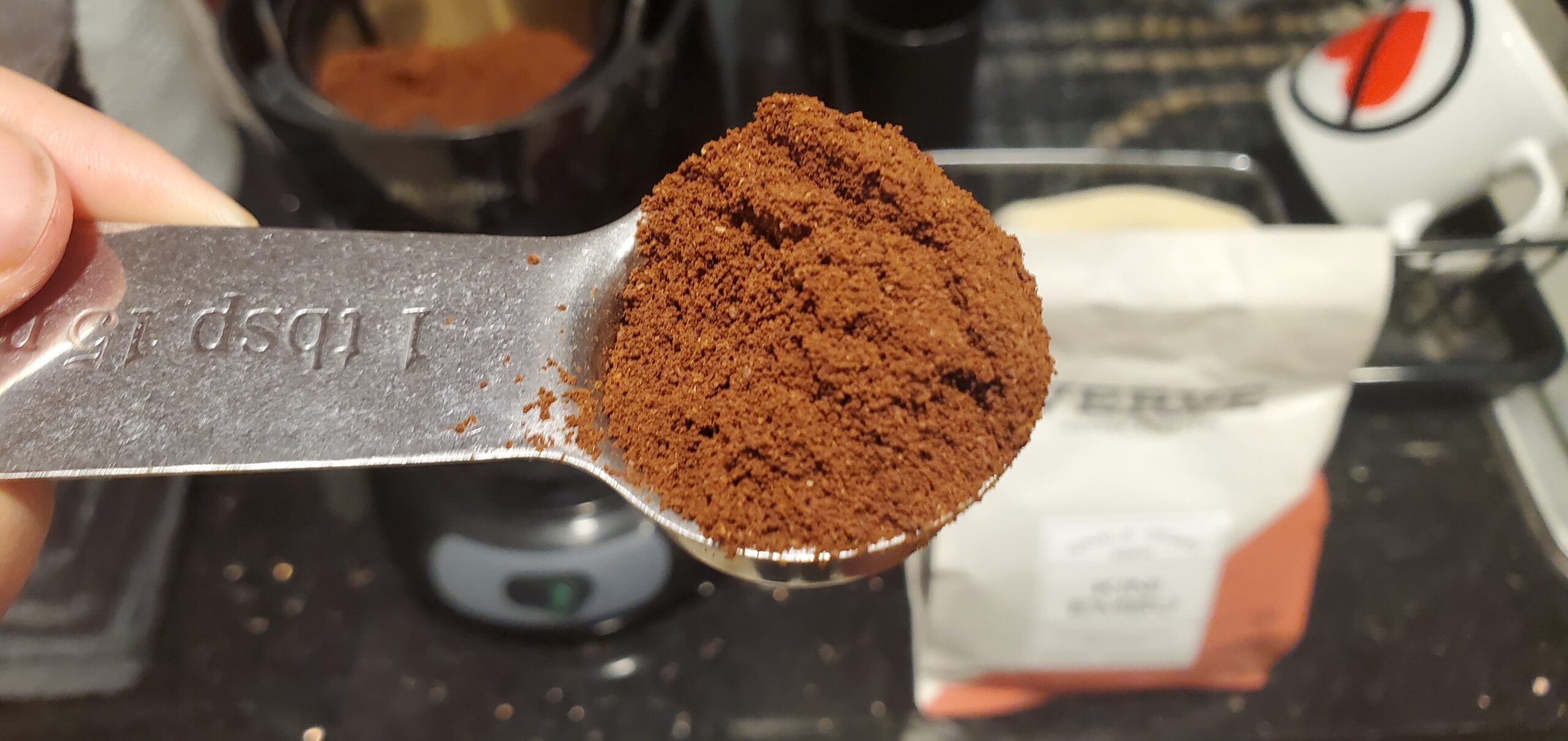 Kini Embu coffee grounds in a tablespoon