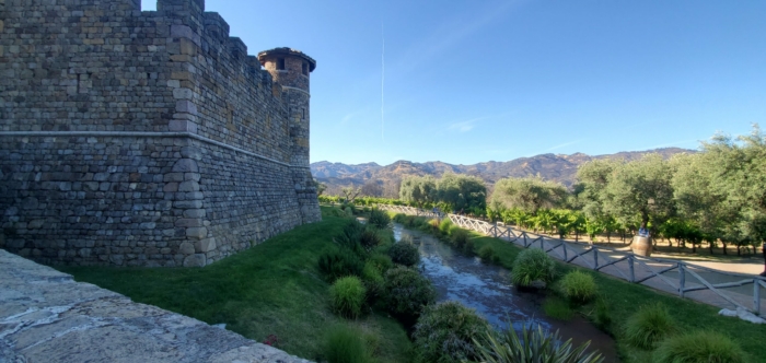 Castello di Amorosa defensive stone walls, moat, forest