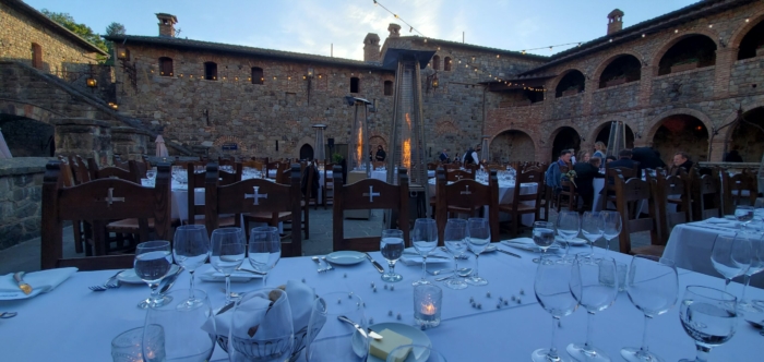 Inner castle courtyard buffet tables during the daytime.