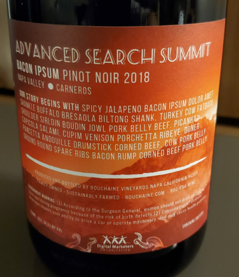 Bacon Ipsum filler text on the back of the wine.