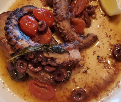 Octopus with potato, cherry tomato, black olive, lemon, red wine vinaigrette