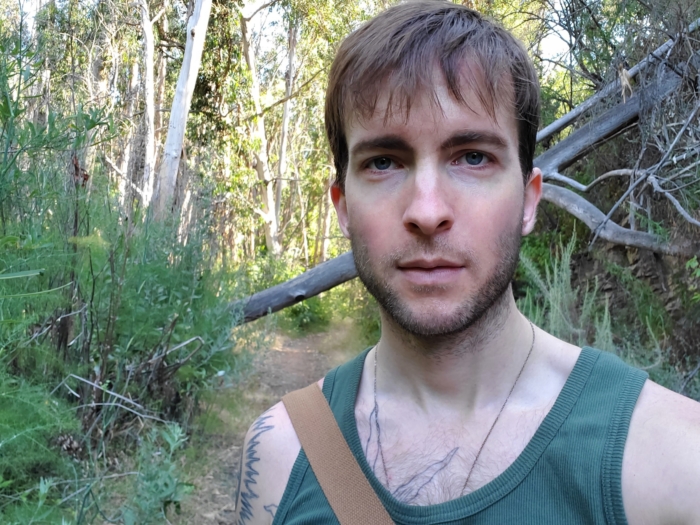 A candid behind the scenes image of Ethan H. outside exploring.